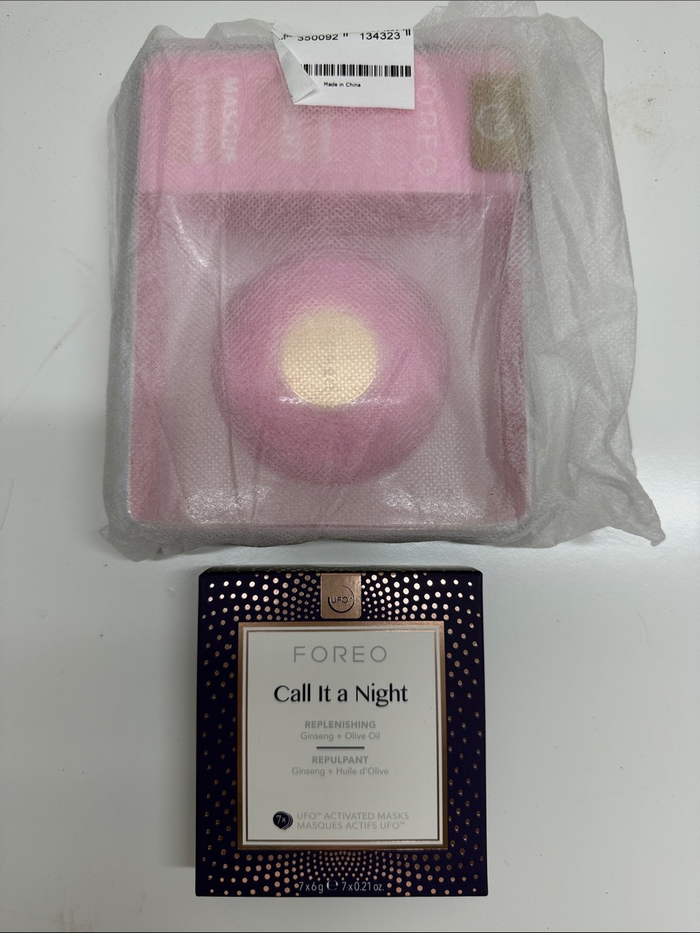 FOREO pink and gold UFO facial device with Call It a Night mask